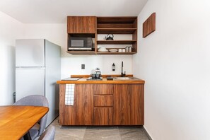 Fridge, microwave, stovetop, coffee/tea maker