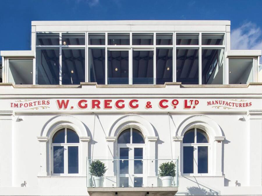A building with a sign reading "W. GREGG & CO. LTD" indicating it is a manufacturer.