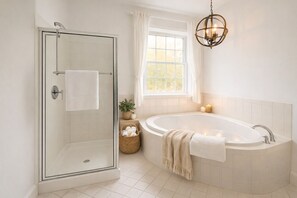 Jetted bath, hair dryer, towels, toilet paper