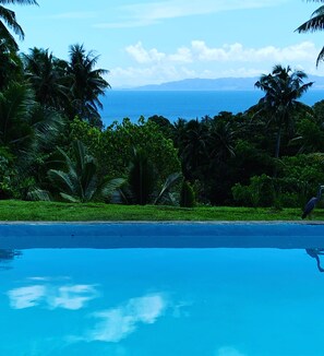 Outdoor pool, open 7:00 AM to 9:00 PM, pool loungers
