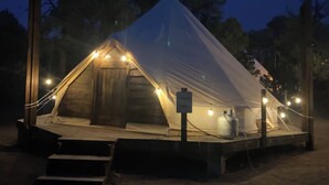 A tent with a ramp, a sign, and lights. - Catch your breath in the beauty of Hope Acres (Strawberry)
