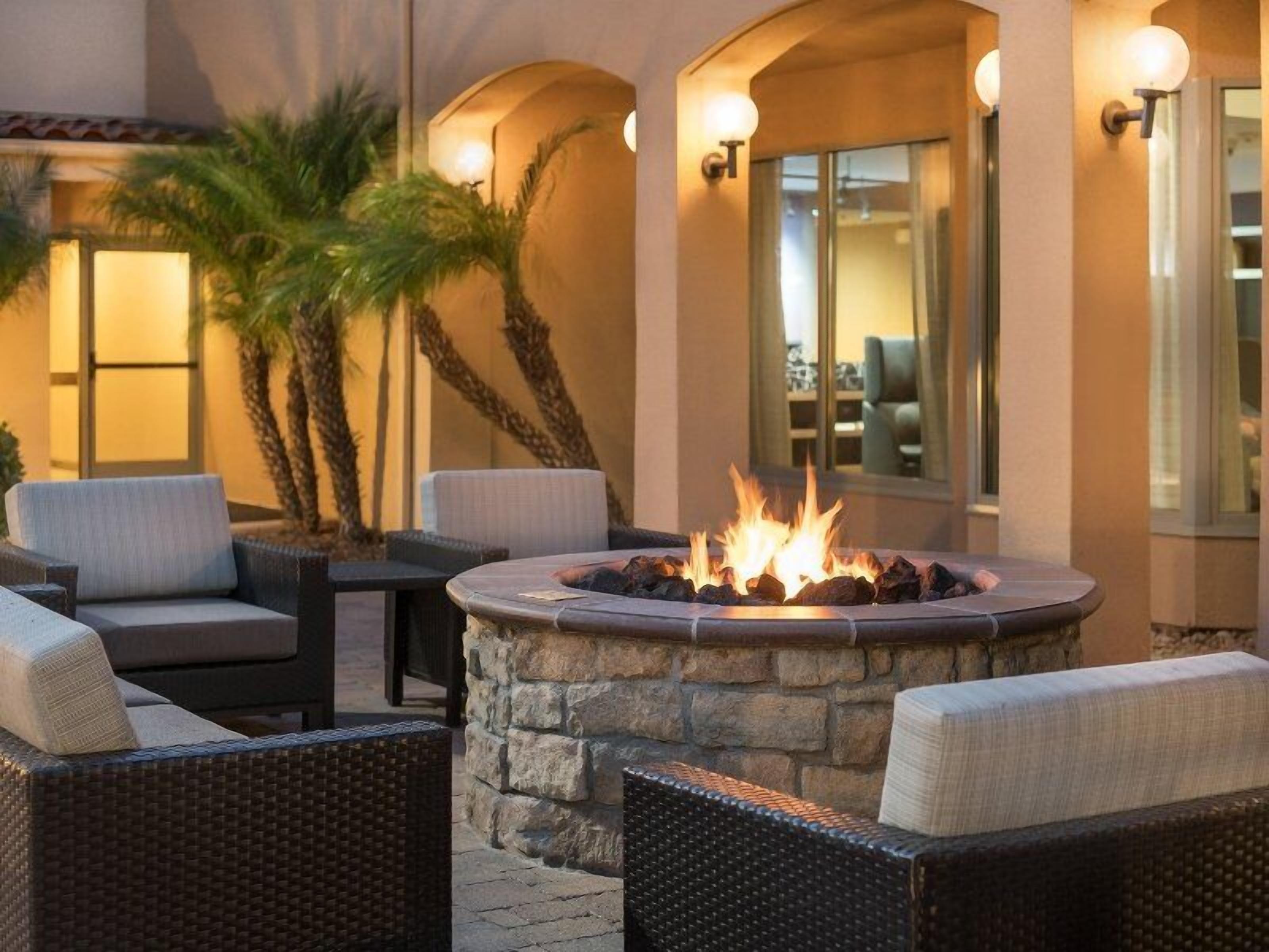 Gather around the glowing fire pit for cozy evening chats.