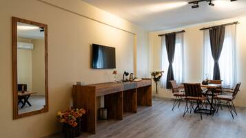 Deluxe Suite, Non Smoking, City View | Desk, laptop workspace, soundproofing, iron/ironing board