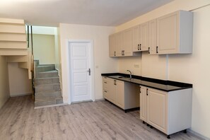 Deluxe Suite, Non Smoking, City View | Desk, laptop workspace, soundproofing, iron/ironing board