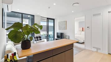 Deluxe Apartment | Living area | 50-inch Smart TV with digital channels, Netflix, streaming services