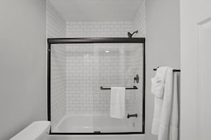 Bathtub, hair dryer, towels