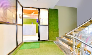 Enjoy a spacious room with a garden area and a staircase leading to additional space.