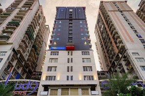 A multi-story hotel with a prominent 'fab hotels' sign on the top. - Fabhotel Prime Cloud 9 (Ghaziabad)