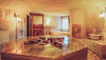 Elite Suite | Bathroom | Designer toiletries, hair dryer, slippers, towels