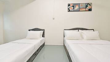 A room with two single beds, white bedding, a light-colored floor, and a wall-mounted abstract art piece.