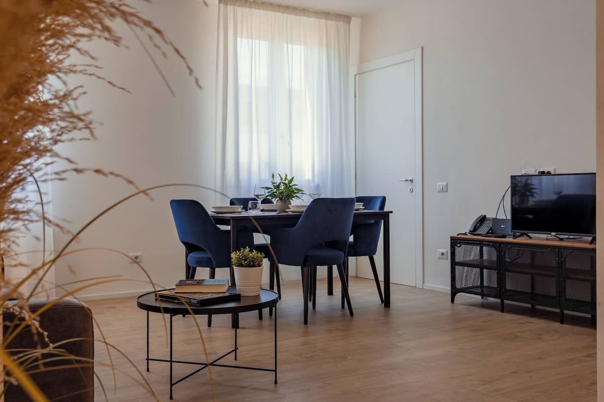 Standard Condo | Living area | 32-inch flat-screen TV with cable channels