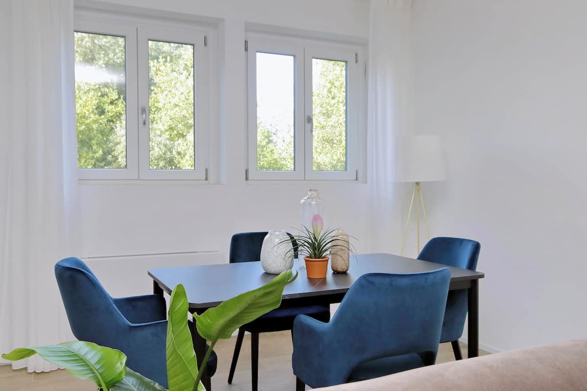 Premium Condo | Living area | 32-inch flat-screen TV with cable channels
