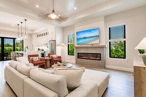 Smart TV, fireplace, books, stereo