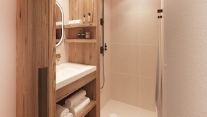Une salle de bain moderne avec un meuble-lavabo en bois, un évier, un miroir et une douche.