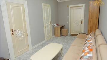 Deluxe Duplex | Living area | 32-inch Smart TV with digital channels