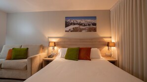 A hotel room with two beds, a large window with curtains, and a painting of a mountain landscape on the wall. - Hotel del Pui by Nexta (La Massana)
