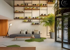 Uma sala de estar moderna com sofá modular, uma mesa de centro e uma grande planta em vaso.