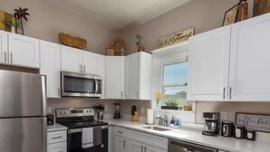 Coffee/tea maker, fridge, microwave, oven