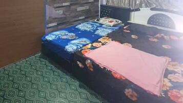 Family Room | Desk, laptop workspace, bed sheets