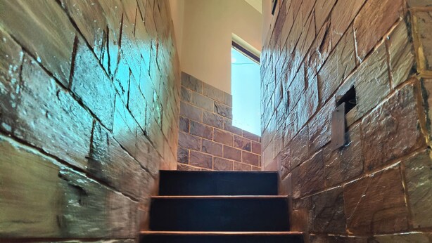 A staircase with wooden steps and stone walls. - Harish Guest House -Railway Station Road (Chandigarh)