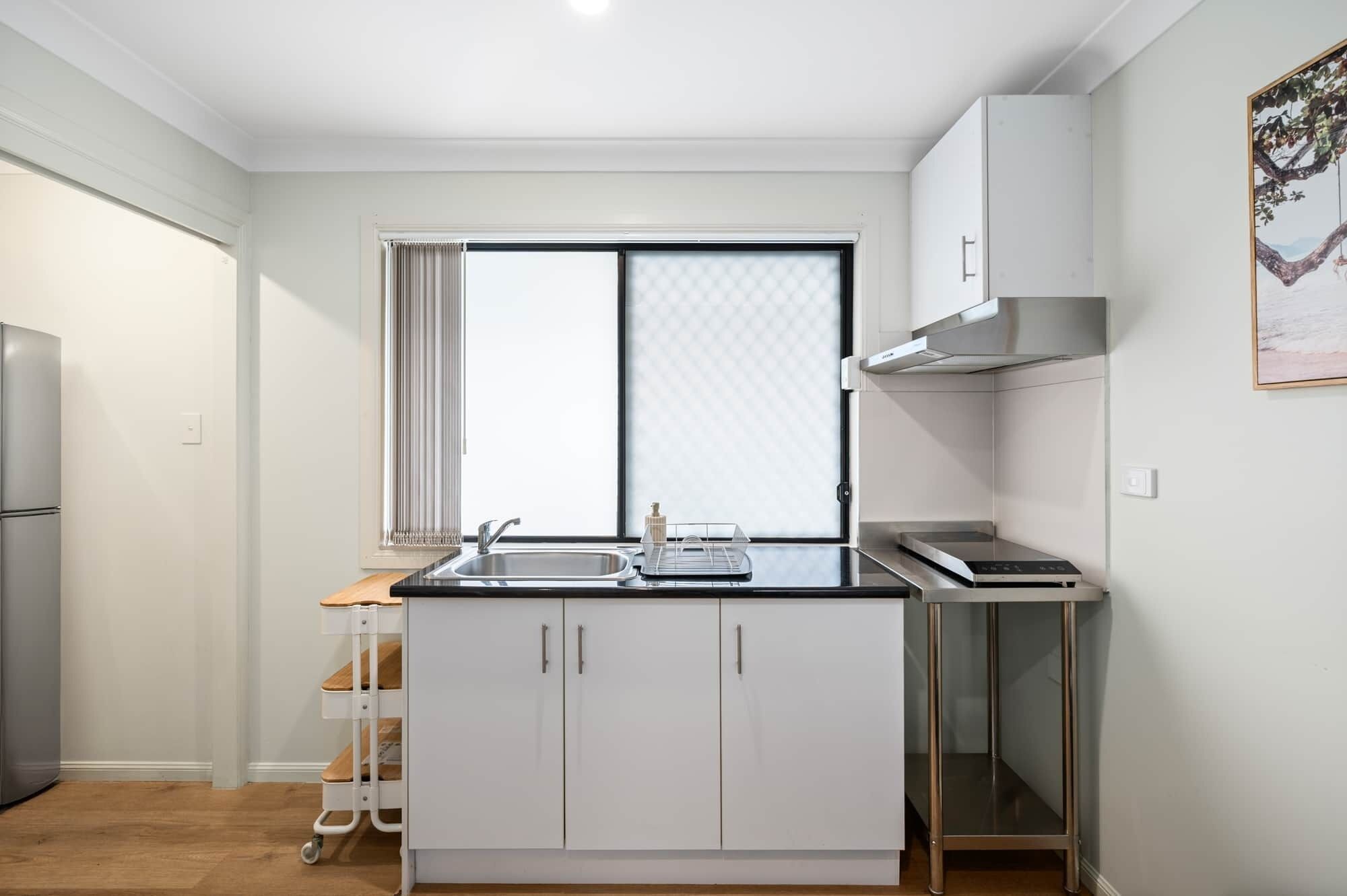 Fridge, microwave, stovetop, coffee/tea maker