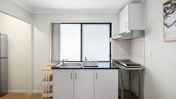 Fridge, microwave, stovetop, coffee/tea maker