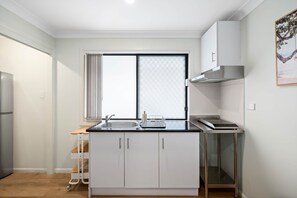 Fridge, microwave, stovetop, coffee/tea maker