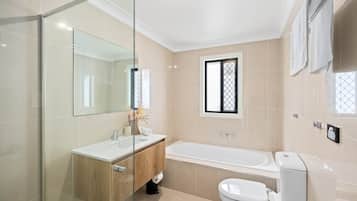 Bathtub, hair dryer, towels