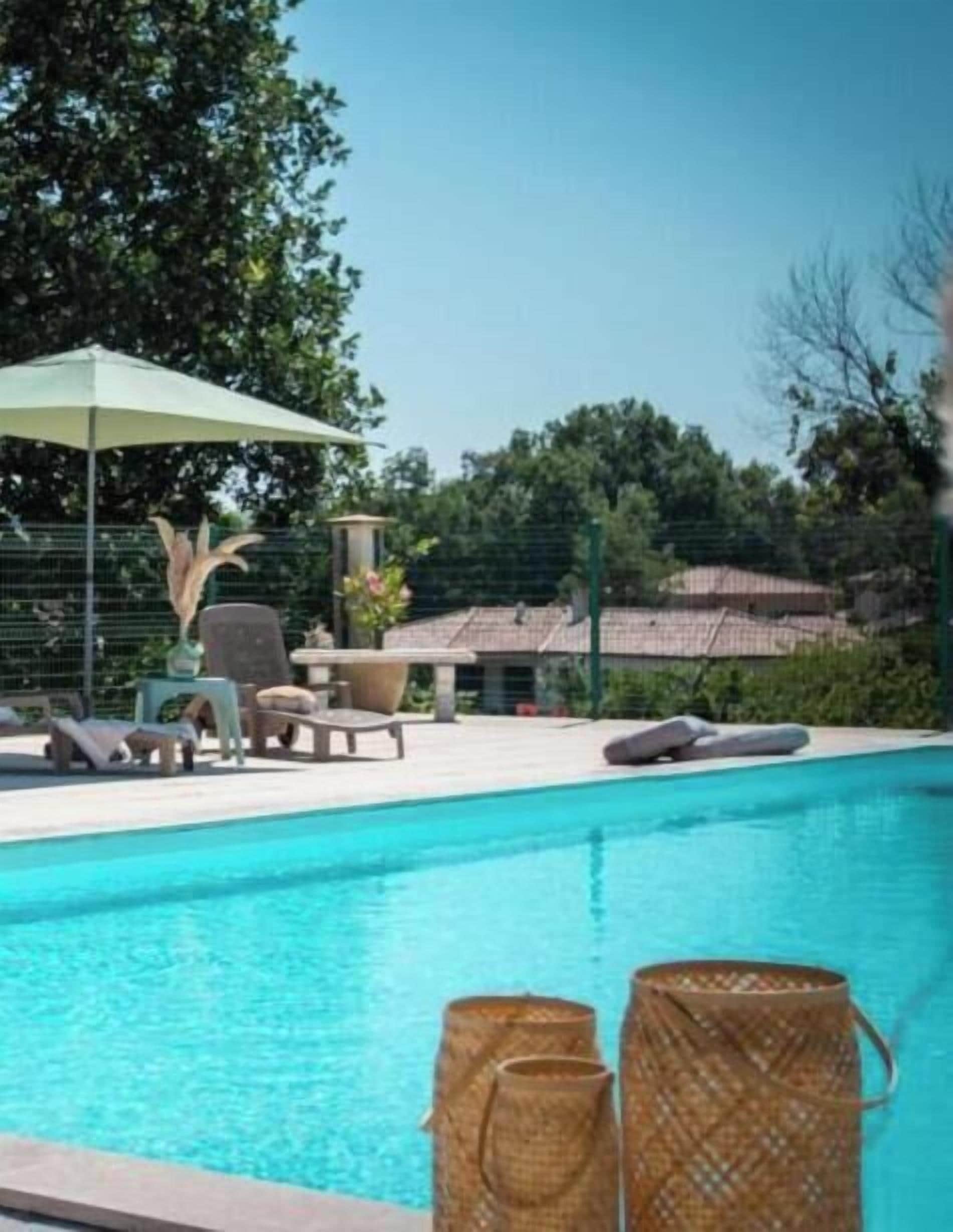 Seasonal outdoor pool, open 10:00 AM to 8:00 PM, pool umbrellas