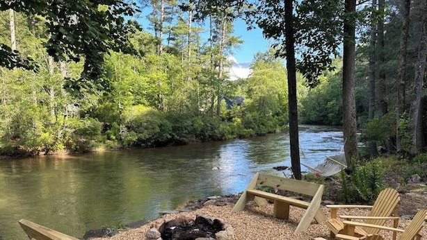 A riverside seating area with a fire pit and Adirondack chairs. - At the End of the Road. Toccoa River Front (Fannin County)