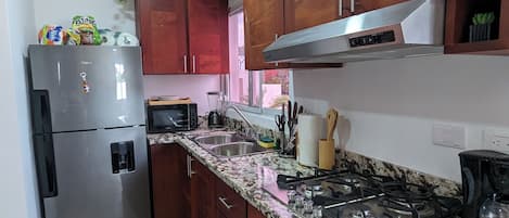 Microwave, stovetop, coffee/tea maker, blender