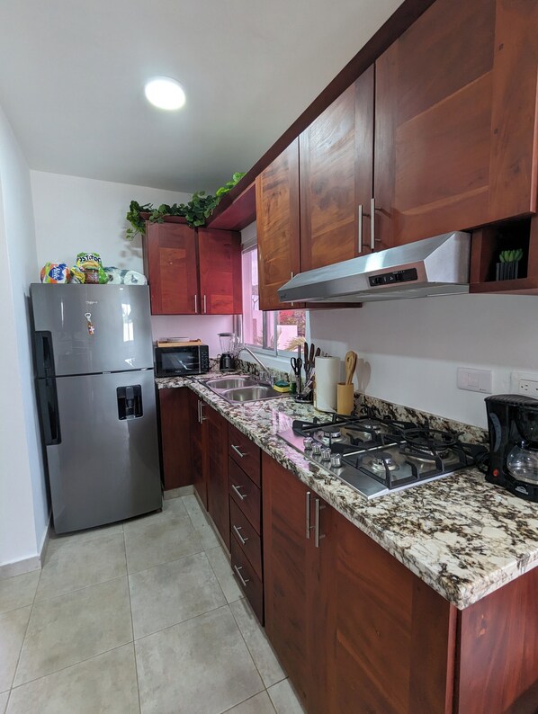 Microwave, stovetop, coffee/tea maker, blender