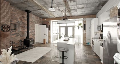 Leslieville LOFT with Wood Burning Fireplace and Skylights! Parking Included.