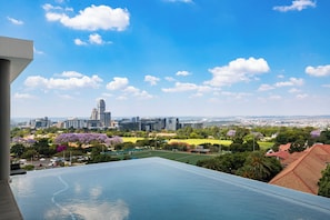 Enjoy breathtaking views of the city skyline from our hotel's outdoor pool.