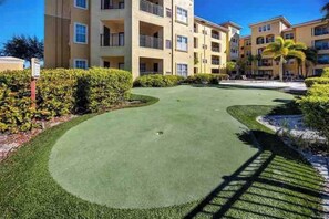 Enjoy a round of golf on our meticulously maintained putting green, surrounded by lush hedges and trees.