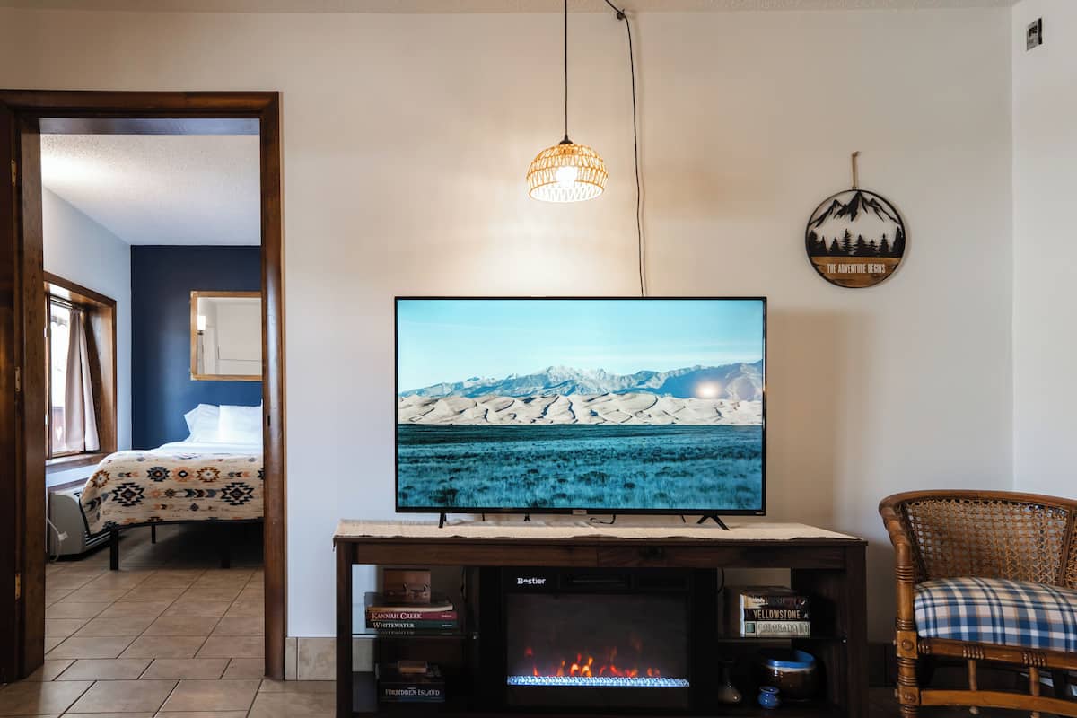 Deluxe Suite | Living room | 50-inch Smart TV with digital channels, streaming services