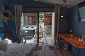 1 bedroom, desk, iron/ironing board, travel crib