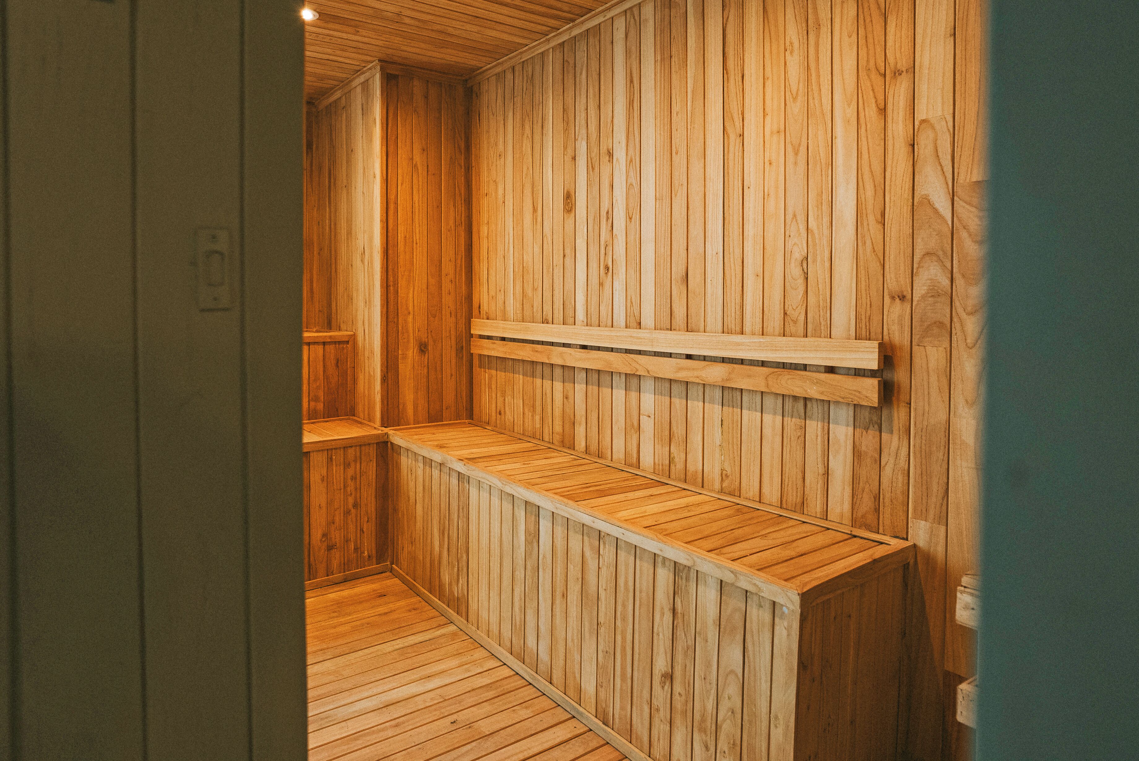 A sauna with wooden walls and benches.