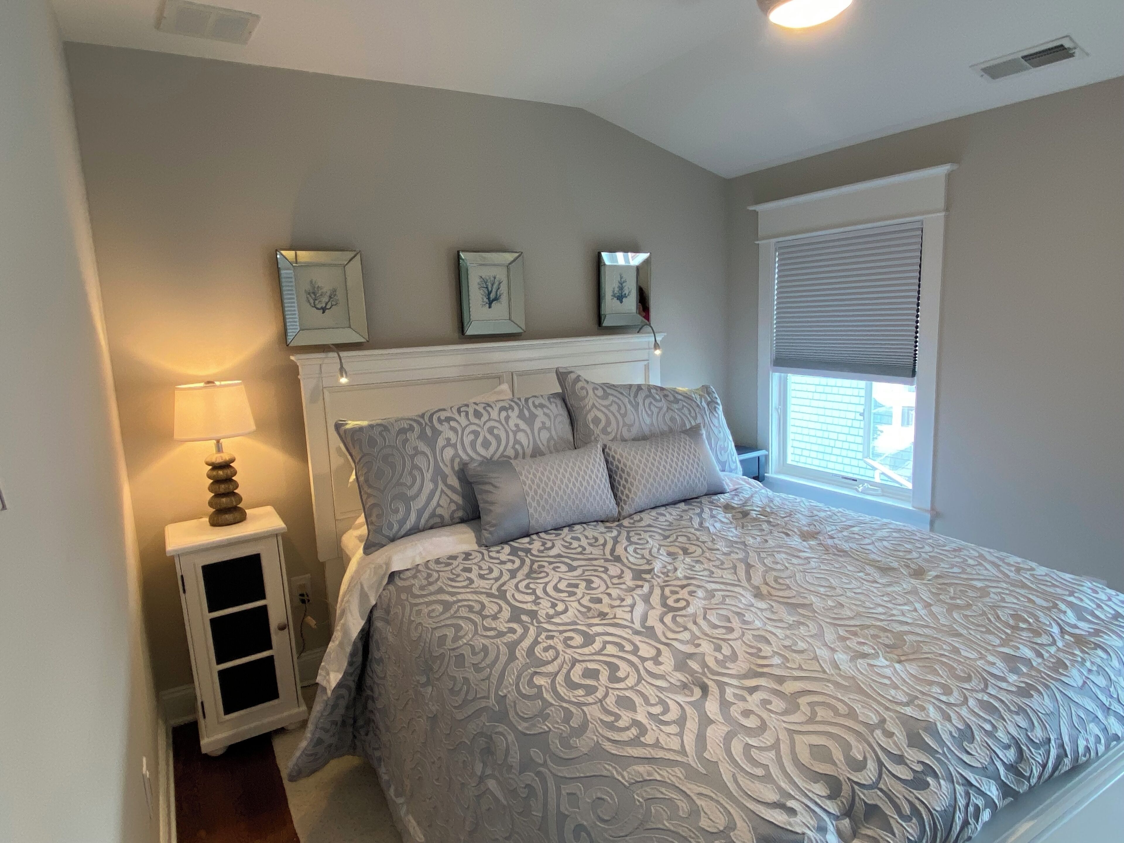 Third floor queen bedroom, little details like bedside reading lights!