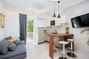 Apartment (1 Bedroom) | Living area | TV