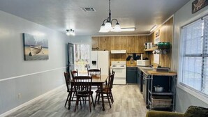 A compact kitchen with wooden cabinets, a microwave, and a sink. - Lanan Hideaway on Toledo Bend >B CLOSE TO TOLEDO TOWN!!!! (Many)