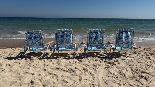 Four beach chairs with a floral pattern facing the ocean. - Ground floor unit! Close to pool and beach. (Saint George Island)