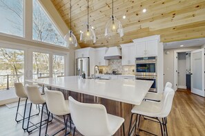 Fridge, microwave, oven, stovetop - Lakefront house with private beach, firepit, dock, 4 kayaks, grill & hot tub (Gray)