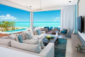 Villa – deluxe | Oppholdsområde | En 49-tommers Flatskjerm-TV med kabel-kanaler