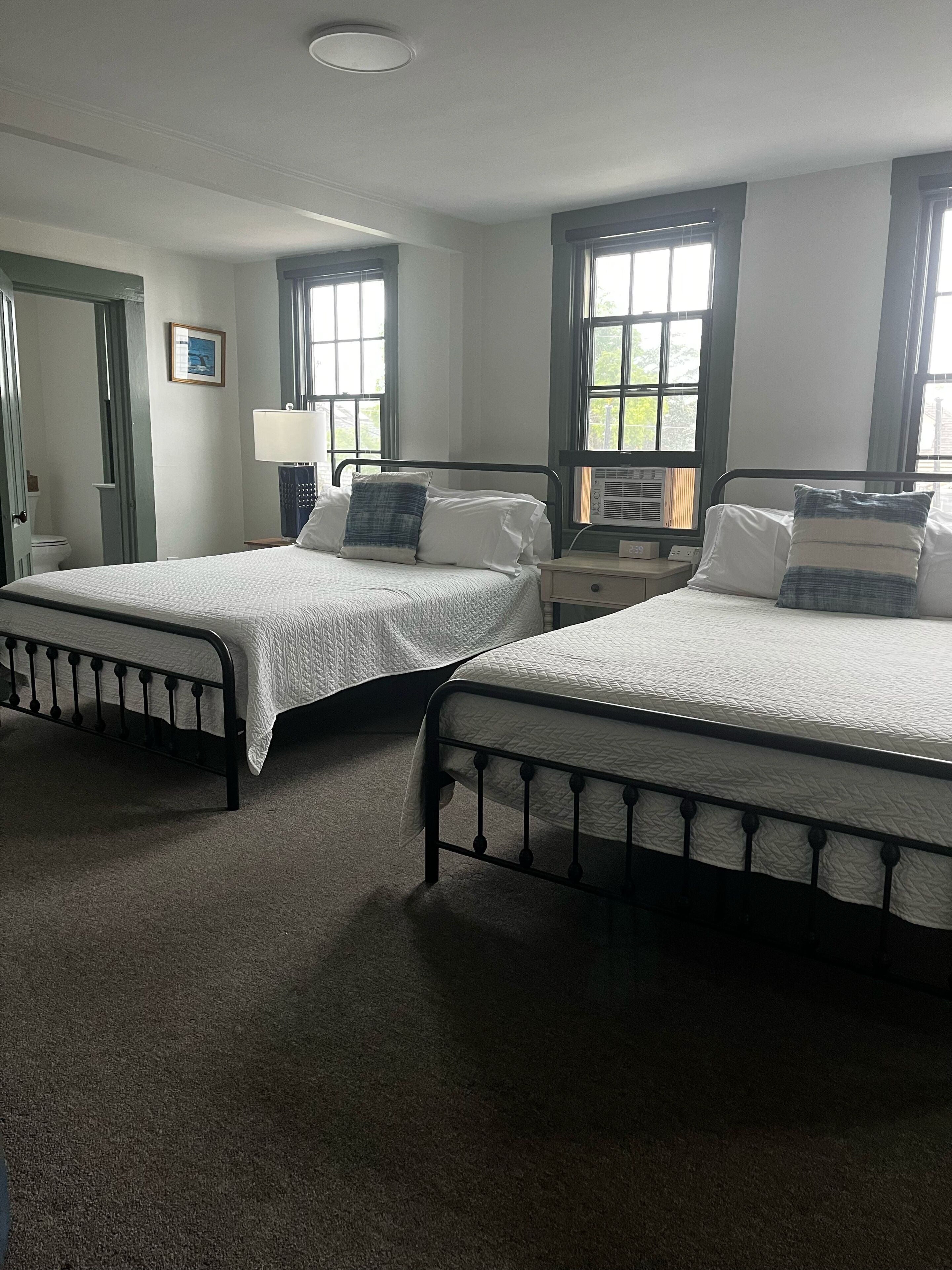 Room, 2 Queen Beds | Iron/ironing board, free WiFi