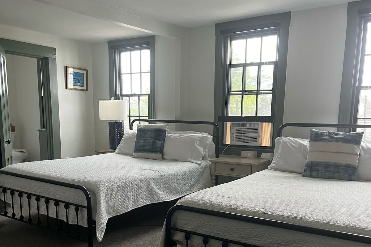 Room, 2 Queen Beds | Iron/ironing board, free WiFi, bed sheets