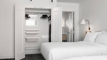 Premium bedding, blackout curtains, soundproofing, iron/ironing board