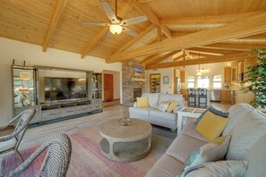 TV, fireplace, books - Inviting Manchester Home w/ Hot Tub Near Beach! (Manchester)