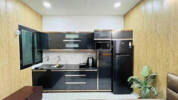 Fridge, electric kettle, cookware/dishes/utensils