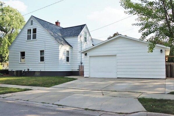 A two-story house with a garage.